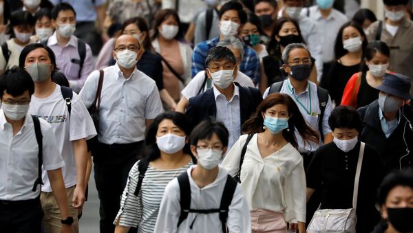 Những người đeo mặt nạ bảo hộ ở Tokyo, Nhật Bản - Sputnik Việt Nam