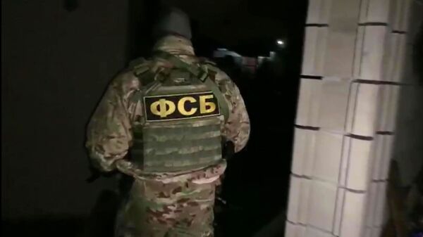 Một nhân viên của FSB Liên bang Nga trong  chiến dịch đặc biệt nhằm bắt  giữ các thành viên của một tổ chức khủng bố. - Sputnik Việt Nam