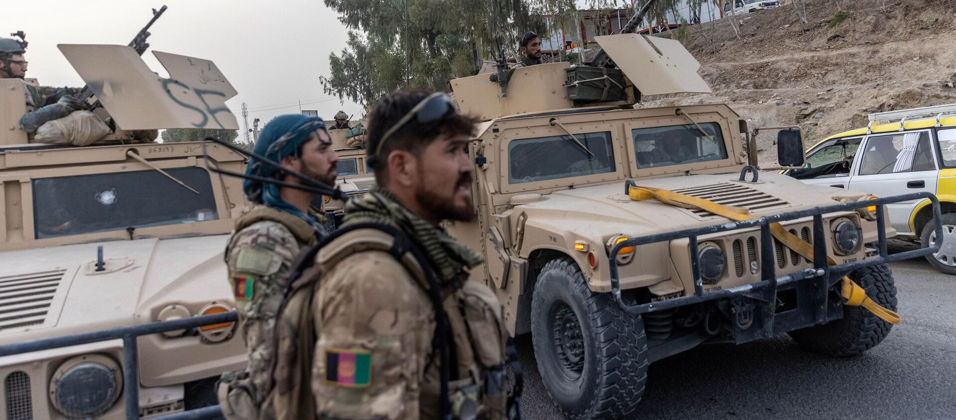 Một đoàn xe của Lực lượng đặc biệt Afghanistan được nhìn thấy trong nhiệm vụ giải cứu một cảnh sát bị bao vây tại một trạm kiểm soát do Taliban bao vây, ở tỉnh Kandahar, Afghanistan, ngày 13 tháng 7 năm 2021 - Sputnik Việt Nam, 1920, 01.08.2021