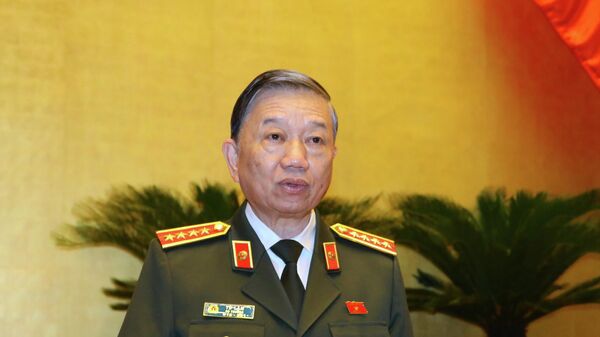 Bộ trưởng Bộ Công an Tô Lâm trình bày Báo cáo công tác phòng, chống tội phạm và vi phạm pháp luật năm 2021 - Sputnik Việt Nam