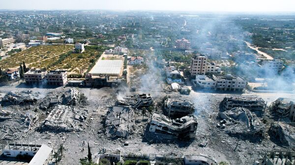Hình ảnh từ trên không trung cho thấy các tòa nhà bị phá hủy ở thị trấn al-Zahra, phía nam Thành phố Gaza - Sputnik Việt Nam