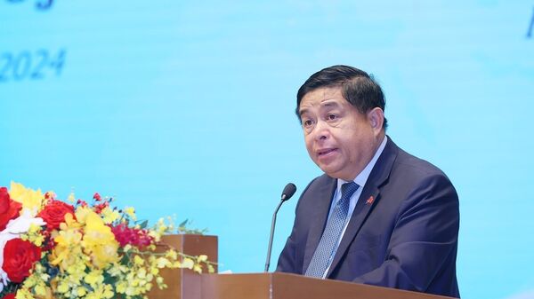 Bộ trưởng Bộ Kế hoạch và Đầu tư Nguyễn Chí Dũng phát biểu khai mạc hội nghị - Sputnik Việt Nam