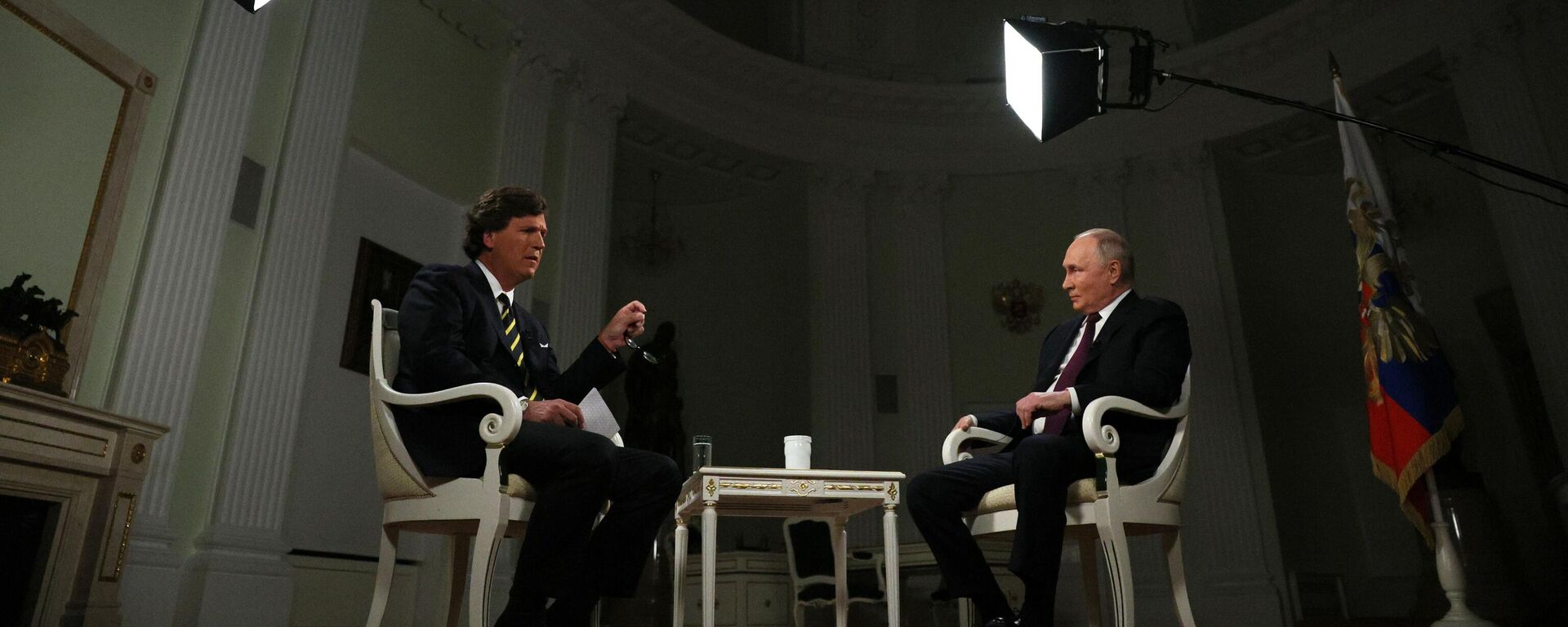Russian President Vladimir Putin listens to a question during an interview with US journalist Tucker Carlson at the Kremlin in Moscow, Russia. - Sputnik Việt Nam, 1920, 11.02.2024