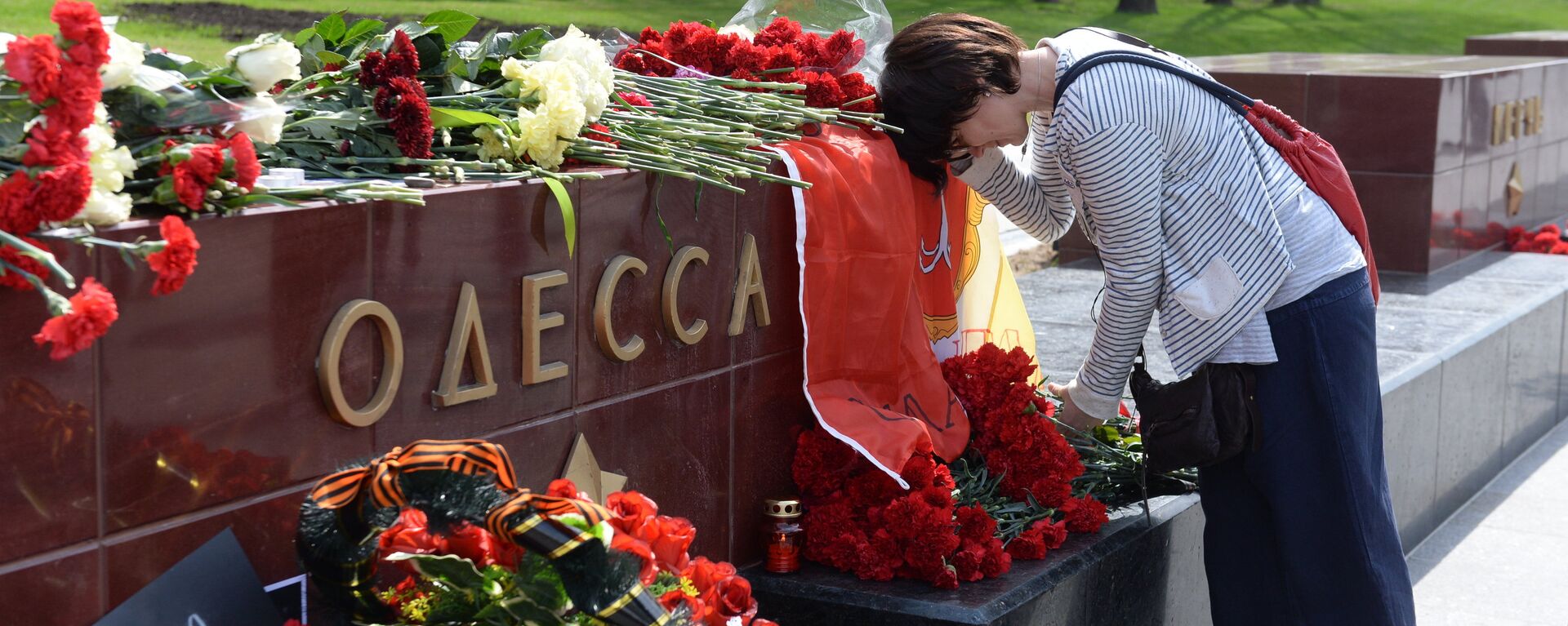 Lễ cầu siêu cho những người thiệt mạng ngày 2 tháng Năm 2014 ở Nhà Công đoàn Odessa  tại Matxcơva - Sputnik Việt Nam, 1920, 02.05.2024