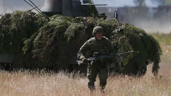 In this Tuesday June 17, 2014 file photo, soldiers from NATO countries practice during a military exercise 'Saber Strike 2014' at the Rukla military base some 120 kms (75 miles) west of the capital Vilnius, Lithuania. - Sputnik Việt Nam