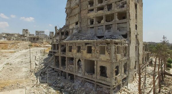 Tòa nhà bị phá hủy ở khu vực Bani Zeid, phía bắc Aleppo - Sputnik Việt Nam