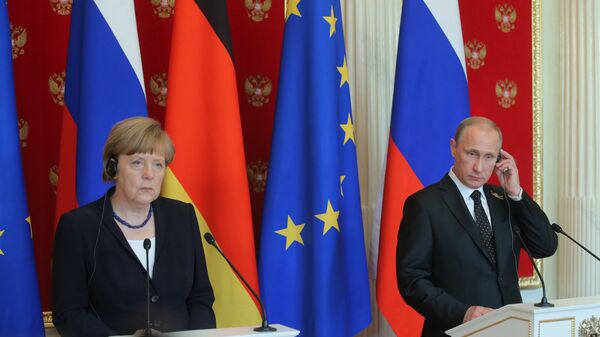 Tổng thống Nga Vladimir Putin và Thủ tướng Đức Angela Merkel - Sputnik Việt Nam