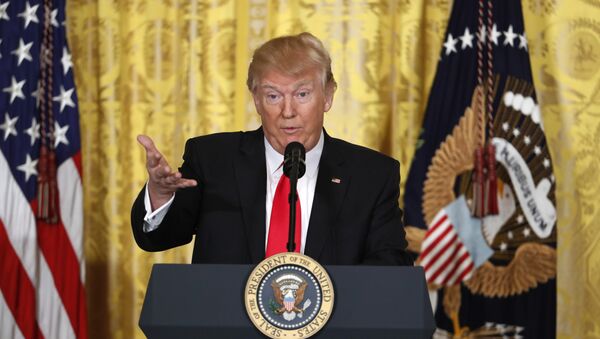 President Donald Trump speaks during a news conference in the East Room of the White House in Washington - Sputnik Việt Nam