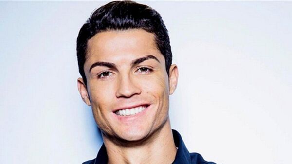 Portuguese Real Madrid footballer Cristiano Ronaldo poses for his new collection of CR7 Shirts - Sputnik Việt Nam