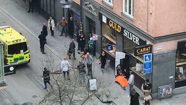 Ambulance in a street near the site were a truck was driven into a crowd in central Stockholm, Sweden - Sputnik Việt Nam