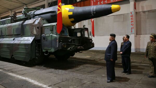 North Korean leader Kim Jong Un inspects the long-range strategic ballistic rocket Hwasong-12 (Mars-12) in this undated photo released by North Korea's Korean Central News Agency (KCNA) on May 15, 2017. - Sputnik Việt Nam