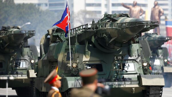 Missiles looking similar to Soviet Scud-As are driven past the stand with North Korean leader Kim Jong Un and other high ranking officials during a military parade in Pyongyang, April 15, 2017. - Sputnik Việt Nam