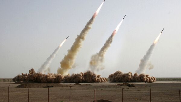A handout picture released on the news website and public relations arm of Iran's Revolutionary Guards, Sepah News, shows an image apparently digitally altered to show four missiles rising into the air instead of three during a test-firing at an undisclosed location in the Iranian desert (File) - Sputnik Việt Nam