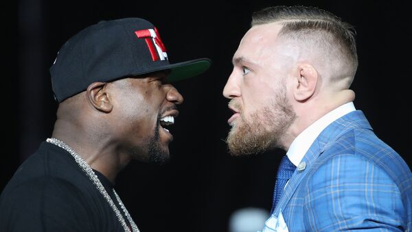 Floyd Mayweather and Conor McGregor stare each other down during a world tour press conference to promote the upcoming Mayweather vs McGregor boxing fight at Budweiser Stage. - Sputnik Việt Nam