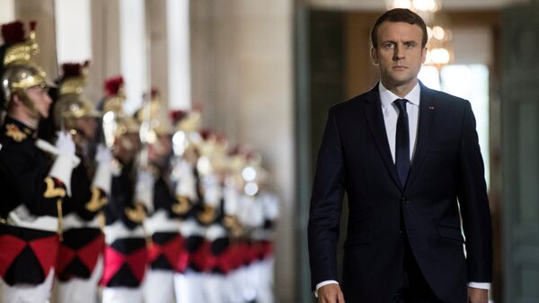 French President Emmanuel Macron walks through the Galerie des Bustes (Busts Gallery) to access the Versailles Palace's hemicycle for a special congress gathering both houses of parliament (National Assembly and Senate), near Paris, France, July 3, 2017. - Sputnik Việt Nam