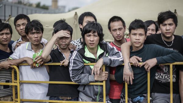 Những người nhập cư trong trại tạm trú ở Golyanovo. Năm 2013 - Sputnik Việt Nam
