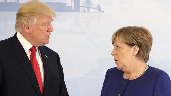 U.S. President Donald Trump, left, and German Chancellor Angela Merkel pose for a photograph prior to a bilateral meeting on the eve of the G-20 summit in Hamburg, northern Germany, Thursday, July 6, 2017 - Sputnik Việt Nam