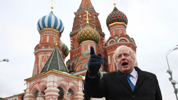British Foreign Secretary Boris Johnson stands in front of Saint Basil's cathedral in Red square in Moscow on December 22, 2017 after a meeting with his Russian counterpart. - Sputnik Việt Nam
