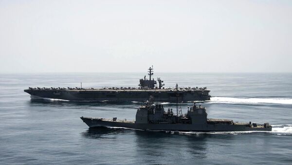 The aircraft carrier USS Theodore Roosevelt (CVN 71) and the guided-missile cruiser USS Normandy (CG 60) operate in the Arabian Sea conducting maritime security operations in this U.S. Navy photo taken April 21, 2015 - Sputnik Việt Nam