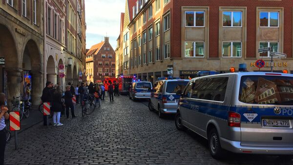 First responders work at the scene when several people were killed and injured when a car ploughed into pedestrians in Muenster, western Germany on April 7, 2018 - Sputnik Việt Nam