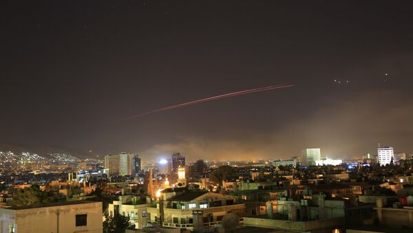 Damascus skies erupt with anti-aircraft fire as the U.S. launches an attack on Syria targeting different parts of the Syrian capital Damascus, Syria, early Saturday, April 14, 2018. Syria's capital has been rocked by loud explosions that lit up the sky with heavy smoke as U.S. President Donald Trump announced airstrikes in retaliation for the country's alleged use of chemical weapons. - Sputnik Việt Nam