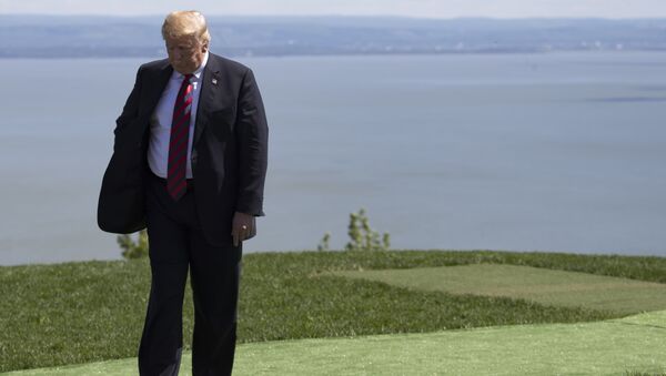 US President Donald Trump steps away after the family photo at the G7 Summit in La Malbaie, Canada, June 8, 2018. - Sputnik Việt Nam