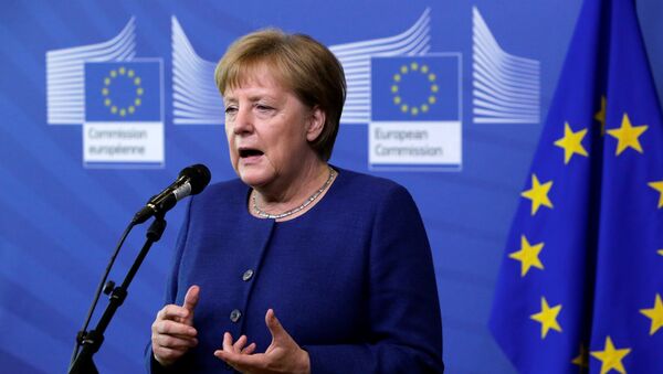 Germany's Chancellor Angela Merkel addresses media representatives as she arrives ahead of a summit at EU headquarters in Brussels on June 24, 2018 - Sputnik Việt Nam
