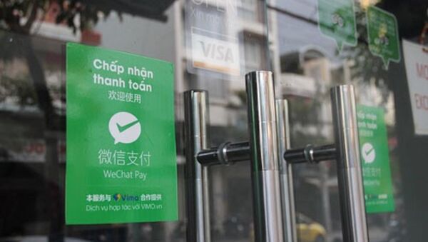 Một cửa hàng ở Khánh Hòa cho phép du khách thanh toán qua WeChat Pay. - Sputnik Việt Nam