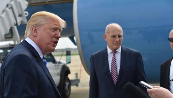 US President Donald Trump speaks to the press before making his way to board Air Force One on May 4, 2018 at Andrews Air Force Base, Maryland as he heads to Dallas, Texas to address the National Rifle Association Leadership Forum. Shown (C) is White House Chief of Staff John Kelly. - Sputnik Việt Nam