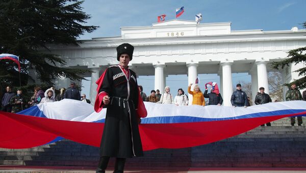 Участники праздничных мероприятий, посвященных второй годовщине присоединения Крыма к России в Севастополе  - Sputnik Việt Nam