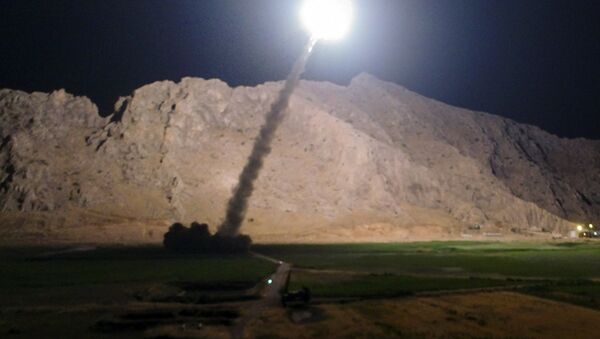 In this picture released by the Iranian state-run IRIB News Agency on Monday, June 19, 2017, a missile is fired from city of Kermanshah in western Iran targeting the Islamic State group in Syria - Sputnik Việt Nam